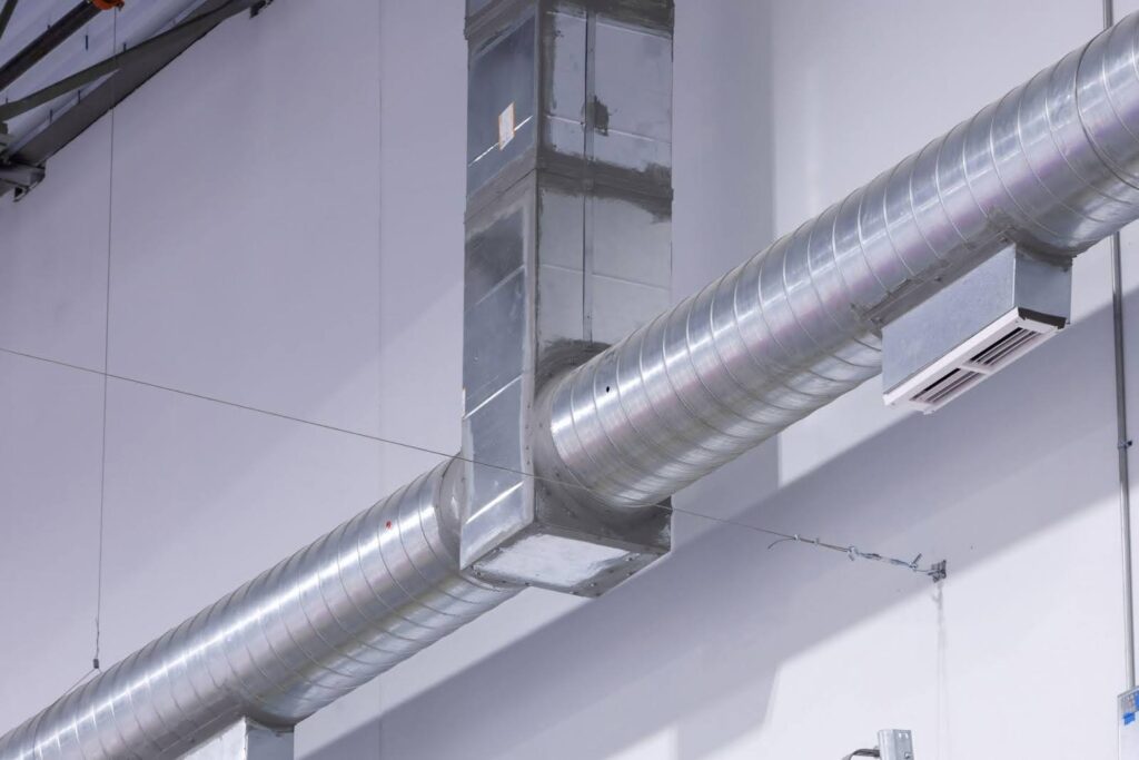 A large pipe with a metal cover showcasing its robust design and industrial functionality